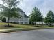 Landscaped exterior with a well maintained yard and black aluminum fencing at 312 Archway Ln, Peachtree City, GA 30269