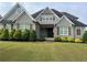 Charming home with a well-manicured lawn and a mix of brick and siding exterior at 312 Archway Ln, Peachtree City, GA 30269