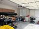 Spacious garage with golf cart, baby stroller, and lots of storage space at 312 Archway Ln, Peachtree City, GA 30269