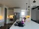 Bright open kitchen with modern island, stainless appliances, and lots of storage at 312 Archway Ln, Peachtree City, GA 30269