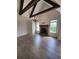 Spacious living room with hardwood floors, a brick fireplace, vaulted ceiling, and large windows at 312 Archway Ln, Peachtree City, GA 30269