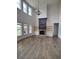 Bright living room boasts a brick fireplace, built-in shelves, and large windows at 312 Archway Ln, Peachtree City, GA 30269