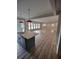 Kitchen island view into the spacious open floorplan, and light hardwood floors at 312 Archway Ln, Peachtree City, GA 30269