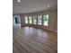 Bright living room with hardwood floors and lots of natural light from many windows at 312 Archway Ln, Peachtree City, GA 30269