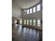 Spacious living room with hardwood floors, a fireplace, and plenty of natural light at 312 Archway Ln, Peachtree City, GA 30269