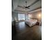 Spacious main bedroom with tray ceilings, hardwood floors, and modern pendant lighting at 312 Archway Ln, Peachtree City, GA 30269