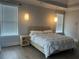 Tranquil bedroom featuring ample light, with a stylish bed and bedside table at 312 Archway Ln, Peachtree City, GA 30269
