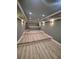 Modern media room featuring tiered seating and stylish wall sconces at 312 Archway Ln, Peachtree City, GA 30269