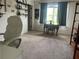 Bright office space with natural light, a desk, shelving, and carpeted floor at 312 Archway Ln, Peachtree City, GA 30269