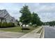 Residential street with sidewalks and well-maintained landscaping on a cloudy day at 312 Archway Ln, Peachtree City, GA 30269