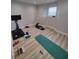 Bright workout room with exercise bike and yoga mat at 312 Archway Ln, Peachtree City, GA 30269