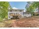 Large backyard featuring a spacious yard, mature trees, and an upper deck at 4367 Cedar Wood Sw Dr, Lilburn, GA 30047