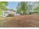 Extensive backyard showcasing a spacious lot with shade trees at 4367 Cedar Wood Sw Dr, Lilburn, GA 30047
