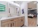 Bright bathroom with double sinks and a view into the main bedroom at 4367 Cedar Wood Sw Dr, Lilburn, GA 30047