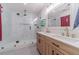 Beautiful bathroom with a double sink vanity and modern glass shower at 4367 Cedar Wood Sw Dr, Lilburn, GA 30047
