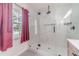 Bright bathroom featuring an elegant glass enclosed shower with tiled walls at 4367 Cedar Wood Sw Dr, Lilburn, GA 30047