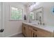Elegant bathroom with double vanity, wood cabinets and brushed gold hardware at 4367 Cedar Wood Sw Dr, Lilburn, GA 30047