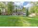 Charming two-story home with lush green lawn and mature trees providing shade and privacy at 4367 Cedar Wood Sw Dr, Lilburn, GA 30047