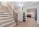 Open foyer showcasing a staircase and entryway to the living room with ample natural light at 4367 Cedar Wood Sw Dr, Lilburn, GA 30047