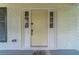 Inviting front door with a welcoming 'Home Sweet Home' doormat on the covered porch at 4367 Cedar Wood Sw Dr, Lilburn, GA 30047