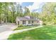 Expansive green lawn and a winding driveway lead to this impressive two-story home at 4367 Cedar Wood Sw Dr, Lilburn, GA 30047