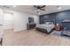 Large main bedroom with wood floors, tasteful decor, and a direct doorway to the ensuite at 4367 Cedar Wood Sw Dr, Lilburn, GA 30047