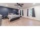 Spacious main bedroom with wood floors, feature wall, and plenty of natural light at 4367 Cedar Wood Sw Dr, Lilburn, GA 30047
