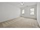 Bright bedroom featuring neutral carpet and two bright windows at 4730 Fairway View Ct, Duluth, GA 30096