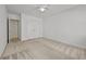 Cozy bedroom features neutral carpet, closet, and ceiling fan at 4730 Fairway View Ct, Duluth, GA 30096