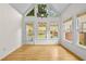 Bright dining area featuring a modern chandelier and multiple windows to the backyard at 4730 Fairway View Ct, Duluth, GA 30096
