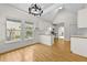 Modern kitchen featuring wood countertops, white cabinets, stainless steel appliances and laminate flooring at 4730 Fairway View Ct, Duluth, GA 30096
