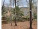 Large backyard with trees, foliage, and a wooden fence; a beautiful natural setting to enjoy year round at 946 Cornwall Sw Ct, Marietta, GA 30064