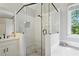Stylish bathroom with white subway tile shower, a soaking tub, and a sleek vanity at 946 Cornwall Sw Ct, Marietta, GA 30064