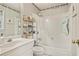 Cozy bathroom with a shower and tub combination, storage, and a sink at 946 Cornwall Sw Ct, Marietta, GA 30064