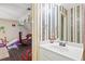 bathroom with playful wallpaper and a white vanity at 946 Cornwall Sw Ct, Marietta, GA 30064
