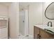 Updated bathroom featuring a modern vanity, sink, and a walk-in shower at 946 Cornwall Sw Ct, Marietta, GA 30064