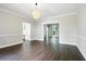 Dining room with hardwood floors and neutral color palette at 946 Cornwall Sw Ct, Marietta, GA 30064