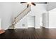 View of hardwood floors, stairs, entry nook, and ceiling fan in the entryway of this home at 946 Cornwall Sw Ct, Marietta, GA 30064