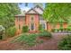 Charming two-story brick home with a well-manicured lawn and mature landscaping in a tranquil setting at 946 Cornwall Sw Ct, Marietta, GA 30064