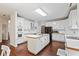 Kitchen with white cabinets, hardwood floors, a large island and stainless steel appliances at 946 Cornwall Sw Ct, Marietta, GA 30064