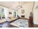 Comfortable living room with vaulted ceilings, fireplace, and ample seating at 946 Cornwall Sw Ct, Marietta, GA 30064