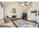 Cozy living room with a fireplace, hardwood floors, a ceiling fan, and a staircase at 946 Cornwall Sw Ct, Marietta, GA 30064