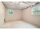 Unfinished basement area with tiled flooring and exposed ceiling at 1094 Seville Dr, Clarkston, GA 30021