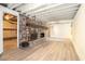 Finished basement featuring a stone fireplace and plank flooring at 1094 Seville Dr, Clarkston, GA 30021