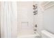 Bathroom featuring tiled shower and bathtub combination at 1094 Seville Dr, Clarkston, GA 30021