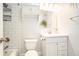 Well-lit bathroom featuring a vanity, mirror, and tiled shower/tub combo at 1094 Seville Dr, Clarkston, GA 30021