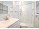 Modern bathroom with tiled shower, glass door, and vanity with sink at 1094 Seville Dr, Clarkston, GA 30021