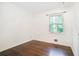 Bright bedroom showcasing hardwood floors and a window with natural light at 1094 Seville Dr, Clarkston, GA 30021