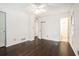 Inviting bedroom with hardwood floors, ceiling fan, and an ensuite bathroom at 1094 Seville Dr, Clarkston, GA 30021