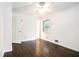 Cozy bedroom features hardwood floors, a window, and a ceiling fan at 1094 Seville Dr, Clarkston, GA 30021